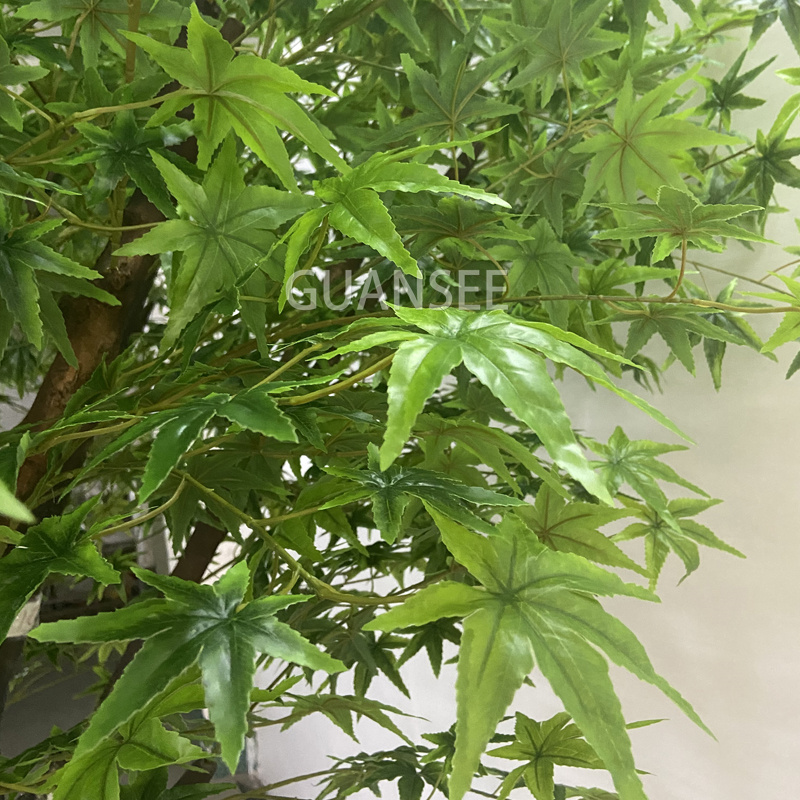 Artificial green maple leaves tree