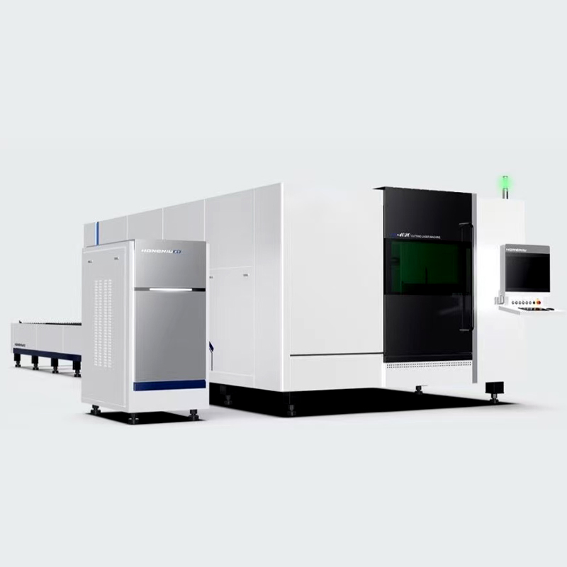 Laser cutting machine with exchange table and cover